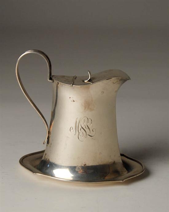 Appraisal: A Sterling Syrup Jug with Undertray marked sterling and with