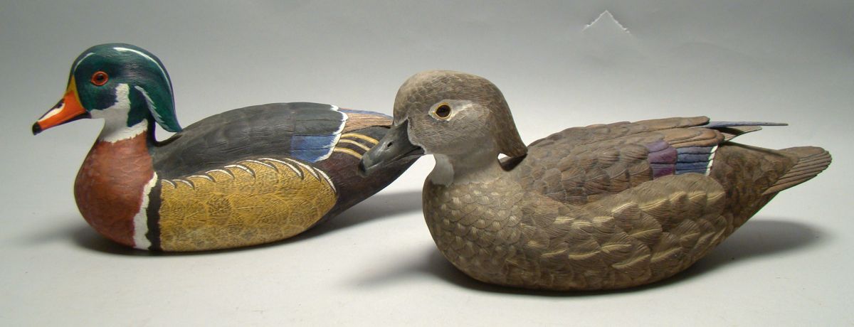 Appraisal: PAIR OF LIFE-SIZE WOOD DUCK DECOYS Decoratively carved by Lewis