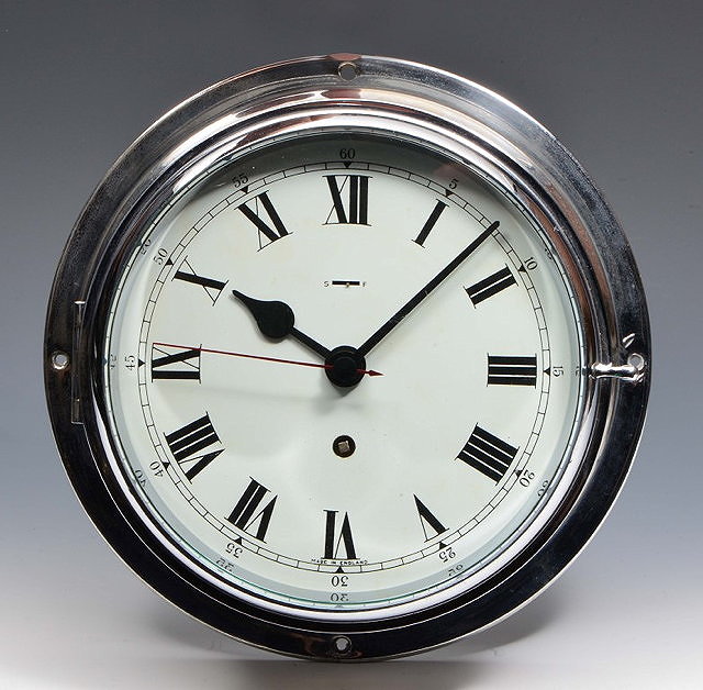 Appraisal: AN ENGLISH SHIPS BULKHEAD TIMEPIECE the white Roman dial with