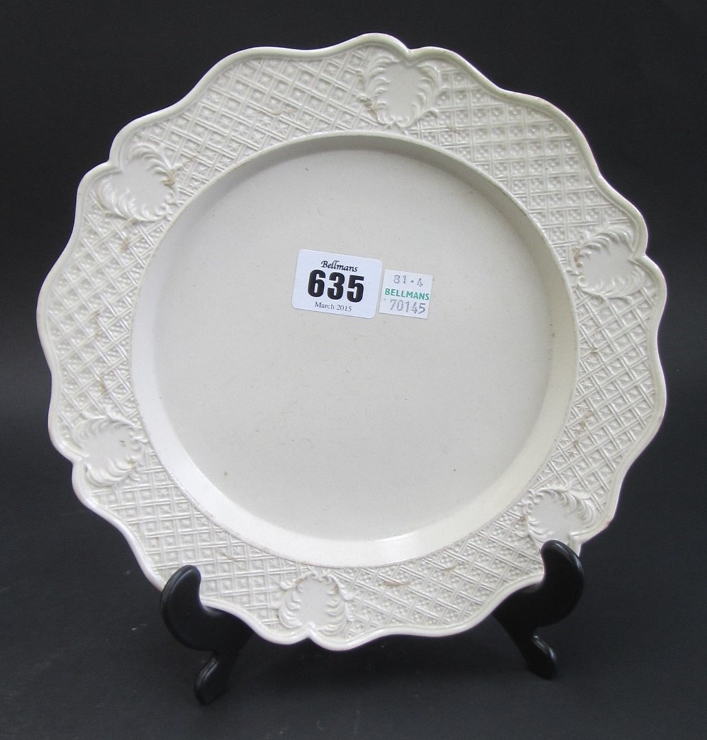 Appraisal: A Staffordshire white saltglazed stoneware plate mid th century with