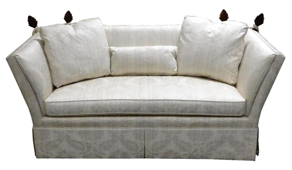 Appraisal: Small sofa with pineapple finials tall upholstered panel sides in