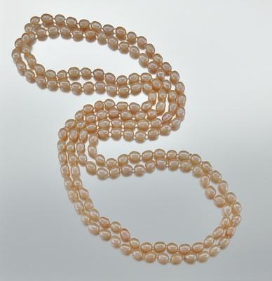 Appraisal: Freshwater Cultured Peach Color Pearl Rope Necklace One long rope