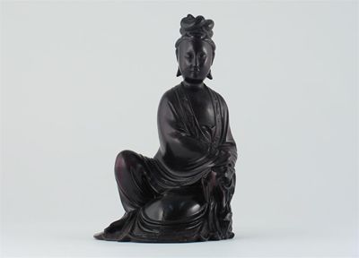 Appraisal: A Chinese hardwood carving of Guanyin seated with one knee