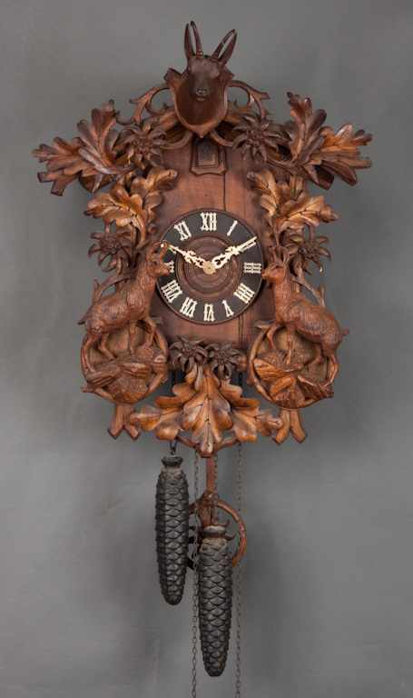 Appraisal: German Black Forest carved walnut cuckoo clock early th century