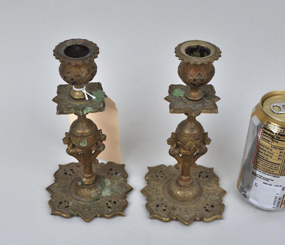 Appraisal: Pair Orientalist Persian Style Brass Candlesticks Arabesque feel griffon sides