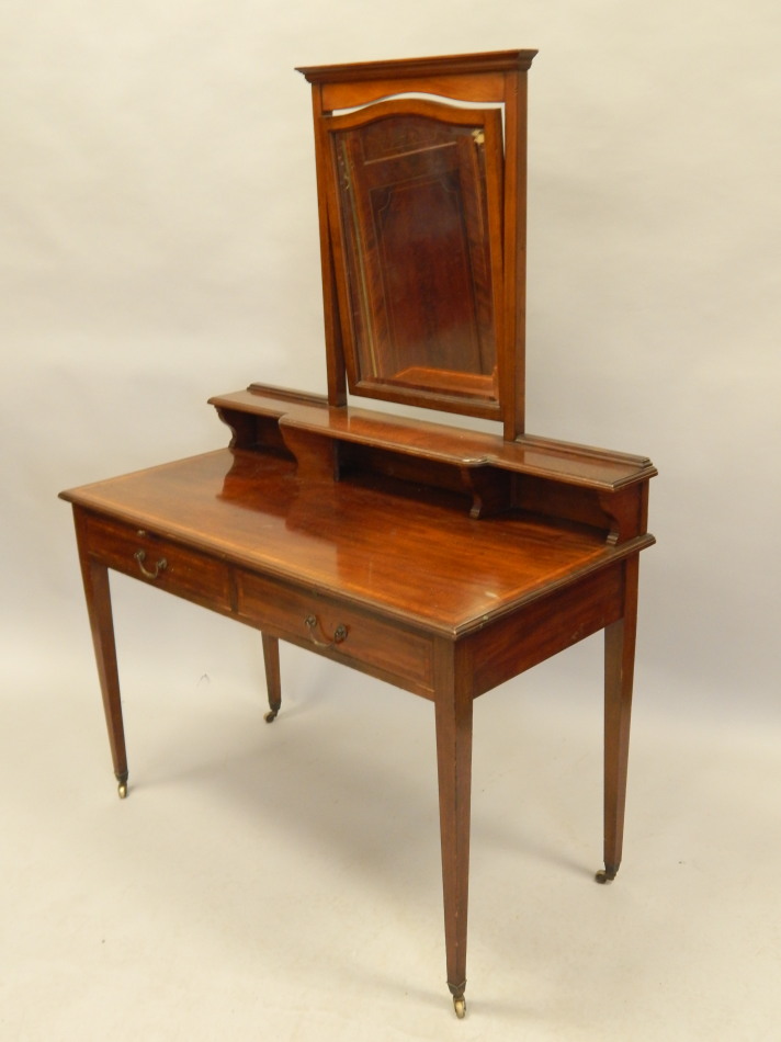 Appraisal: An Edwardian mahogany and satinwood crossbanded dressing table the raised