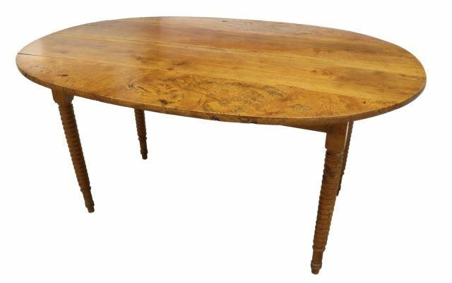 Appraisal: Rustic French mixed wood farmhouse table th c having oval-shaped