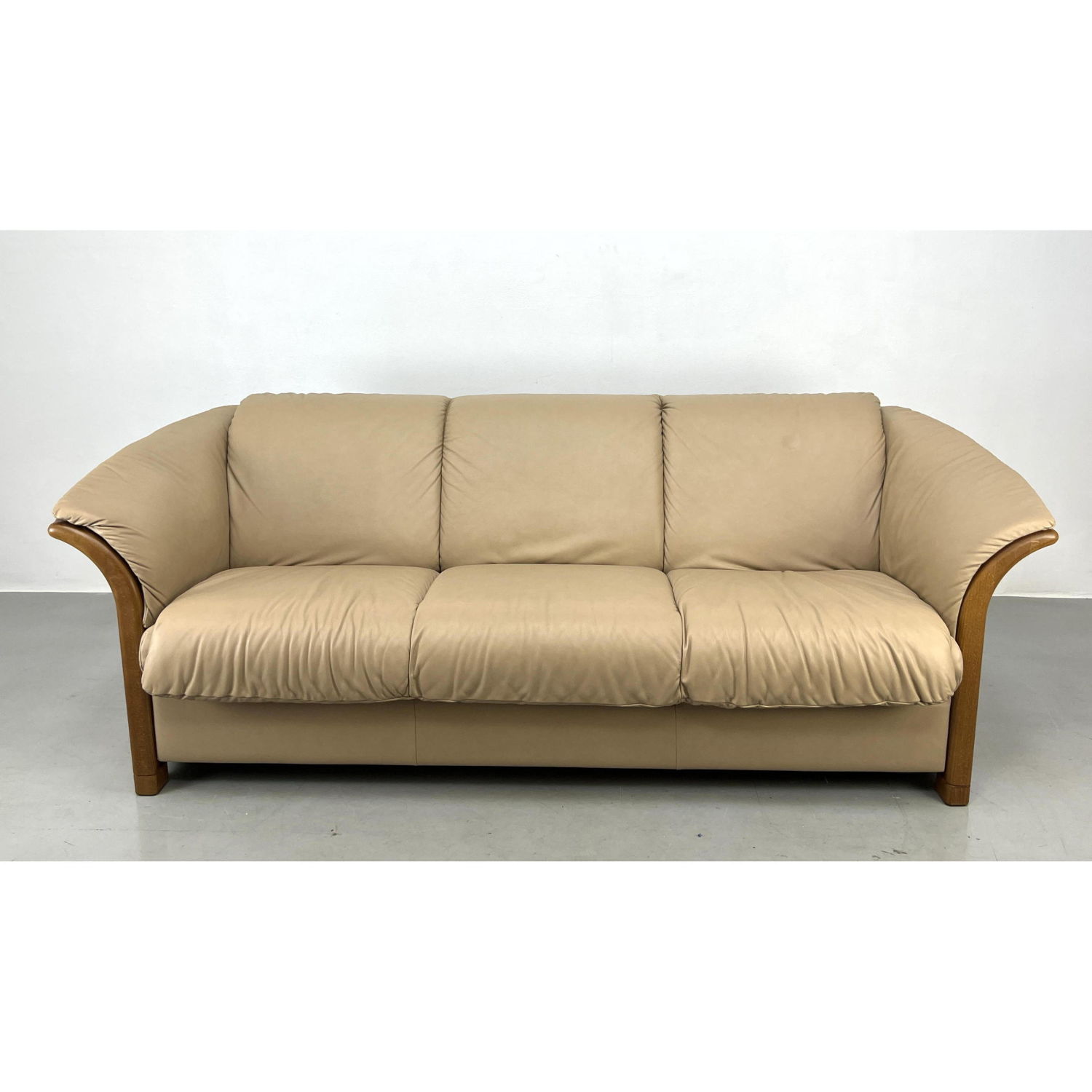 Appraisal: EKORNES sofa Manhattan model leather and wood Marked Dimensions H