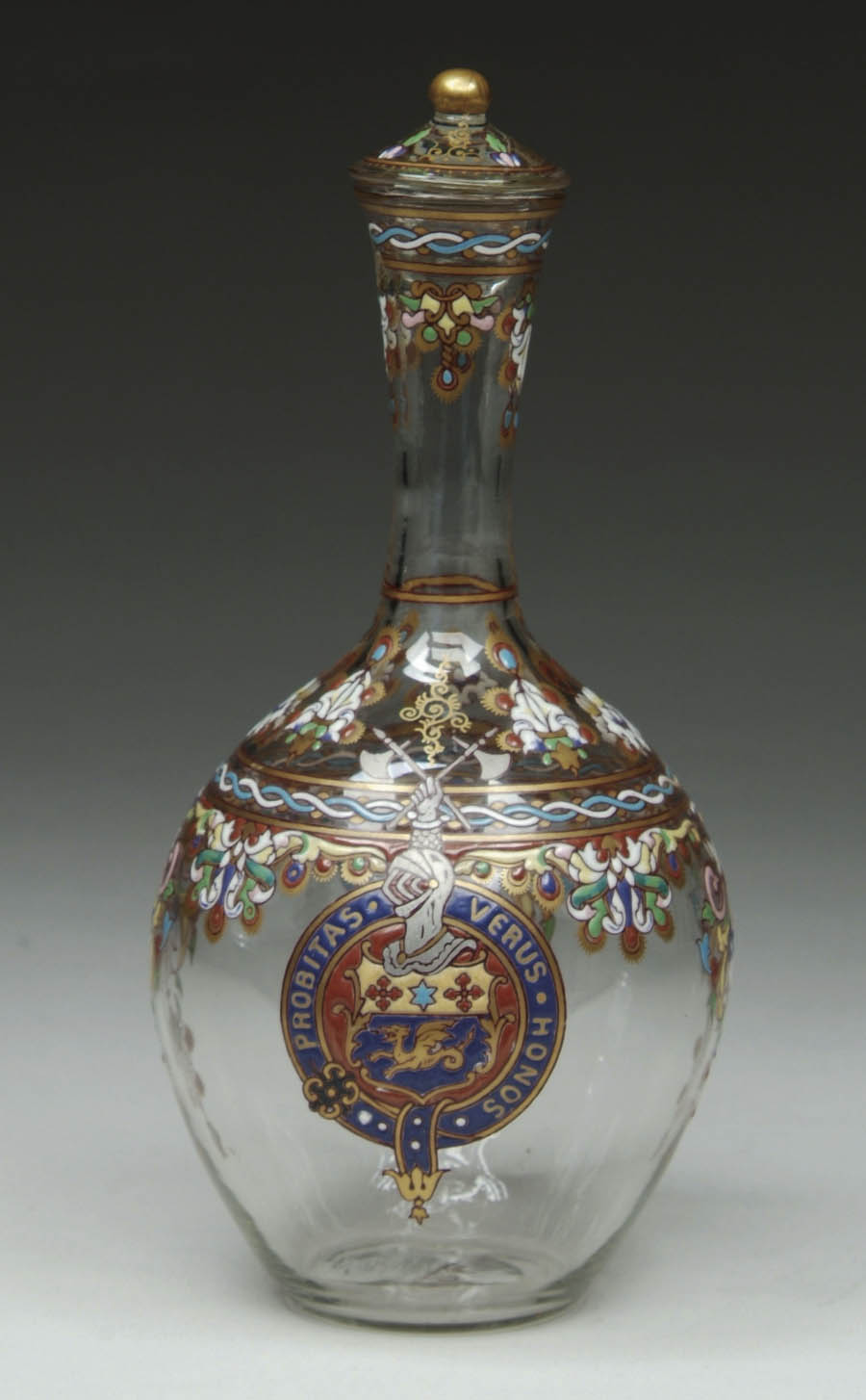 Appraisal: AMBERTON DECANTER Clear glass Amberton decanter is ornately decorated with