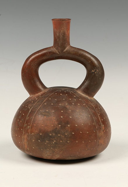 Appraisal: A STIRRUP VESSEL in the form of a sea urchin