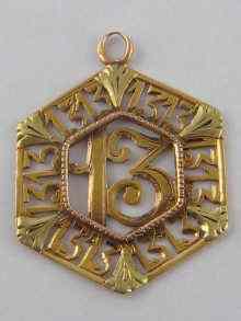 Appraisal: A French hallmarked carat gold two colour pendant designed as