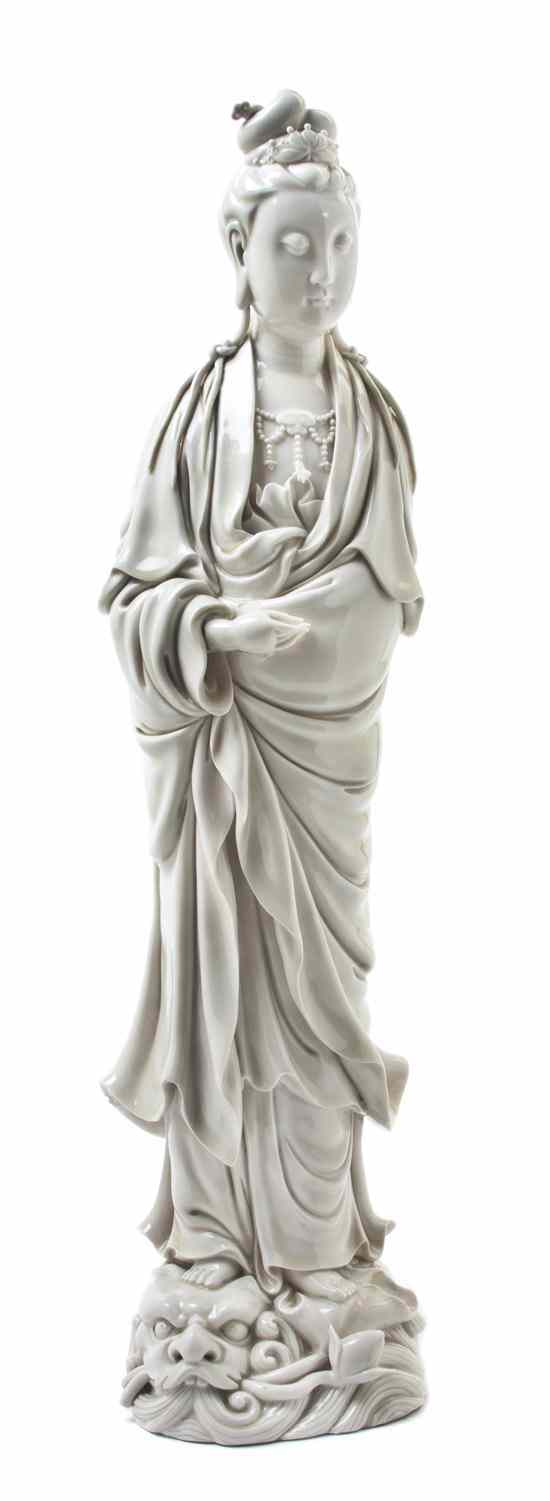 Appraisal: A Blanc de Chine Porcelain Model of Guanyin depicted in