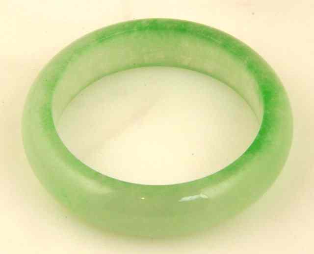 Appraisal: A pale green jade bangle cm diameter