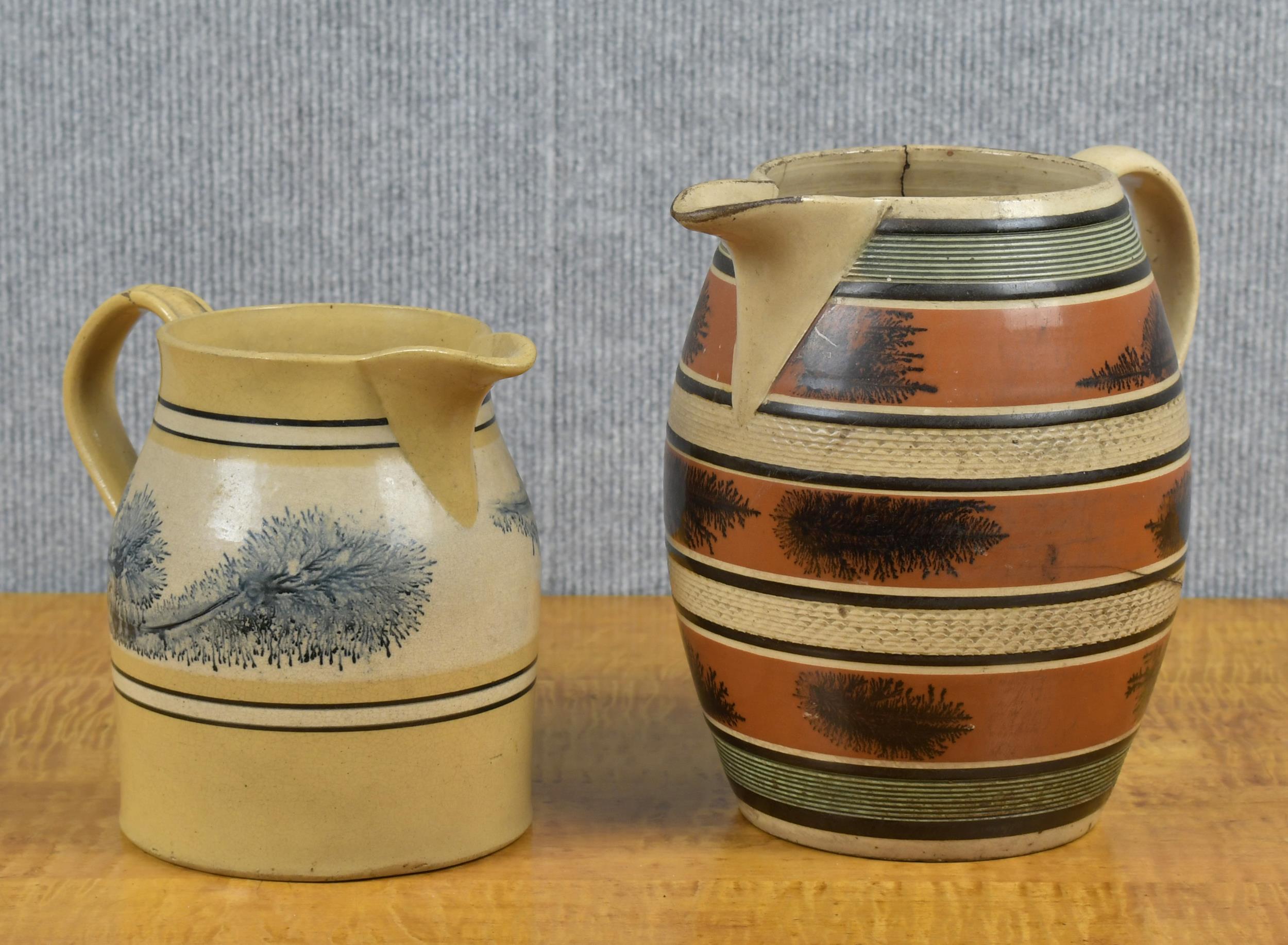 Appraisal: TWO TH C MOCHA WARE PITCHERS Larger banded creamware pitcher