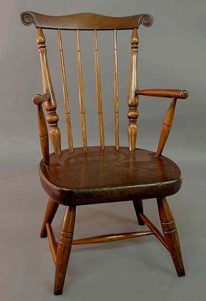 Appraisal: Child's com-back Windsor armchair c with carved ears h x