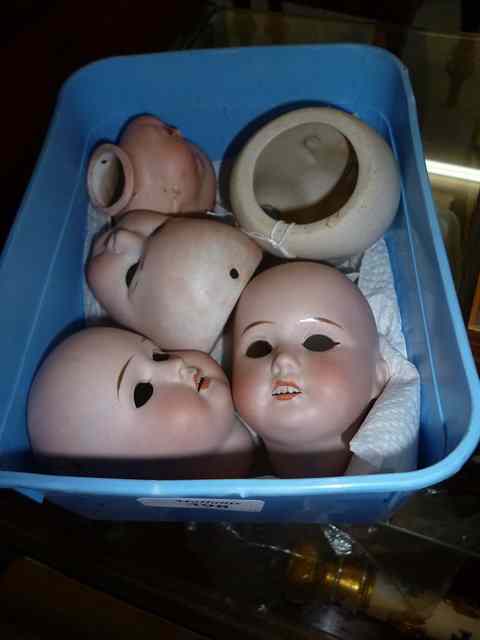 Appraisal: FIVE DUMP DUG BISQUE DOLLS HEADS