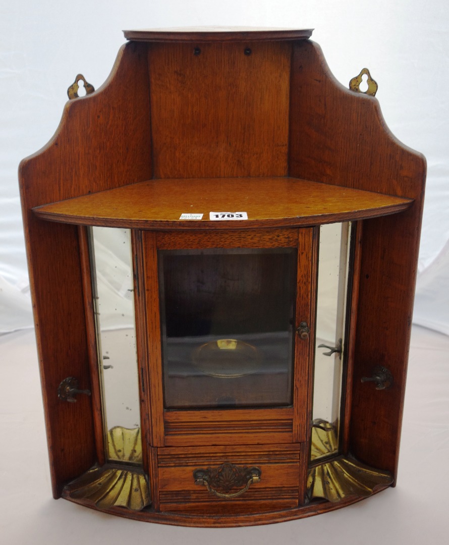 Appraisal: A late th century oak hanging corner smoker's cupboard with