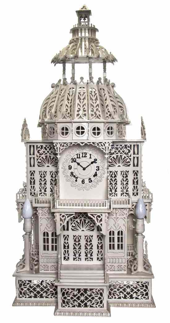 Appraisal: An American Fretwork House Form Clock the circular dial having