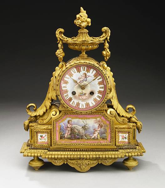 Appraisal: A French gilt bronze and porcelain mounted mantel clock fourth