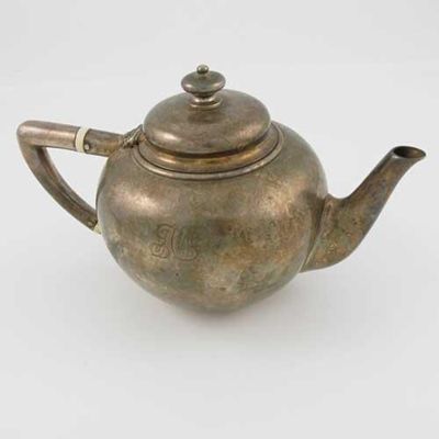 Appraisal: A small Victorian teapot of plain globular form with an