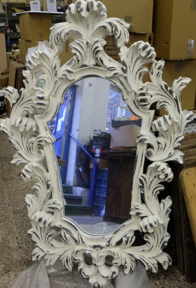 Appraisal: Large resin rococo style distressed mirror some paint flaking height