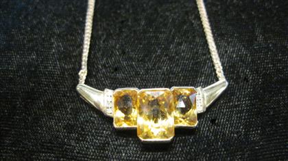 Appraisal: karat yellow gold citrine and diamond necklaceCentral square cut citrine