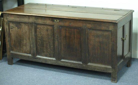 Appraisal: A late th Century oak chest with twin planked top