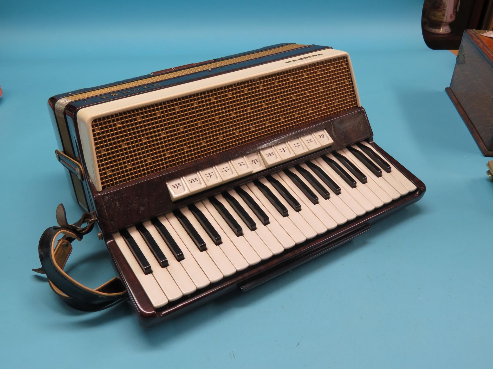 Appraisal: An Hohner Tango VM accordion three-octave keyboard in grained and