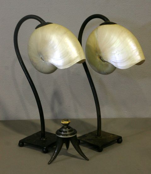 Appraisal: A pair of Iron lamps with shell shades together with