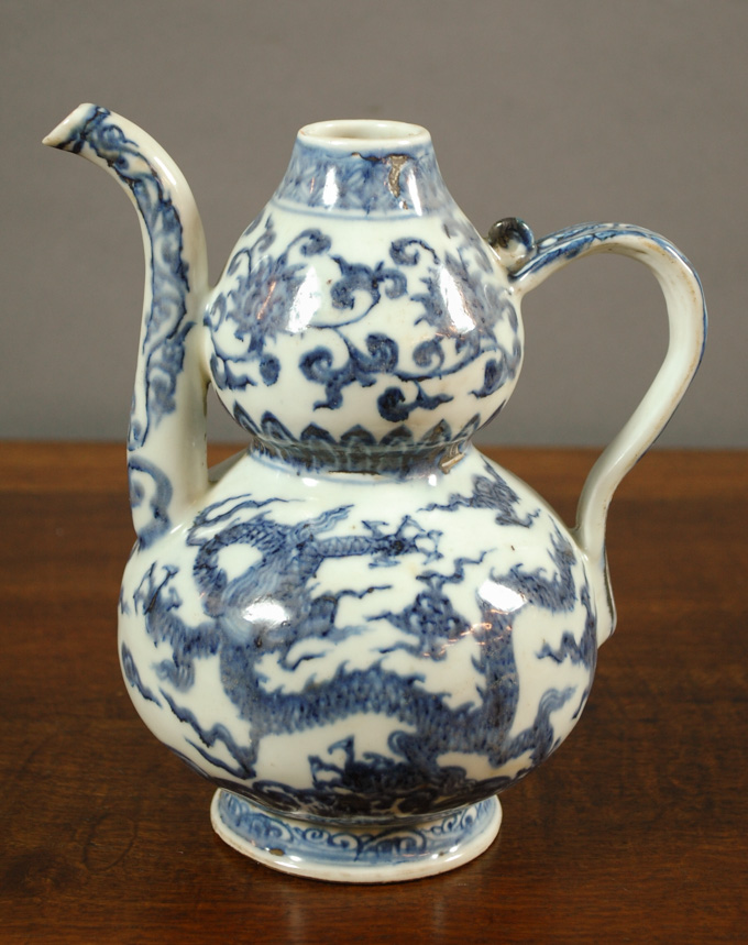 Appraisal: CHINESE MING STYLE PORCELAIN EWER with blue and white glazed