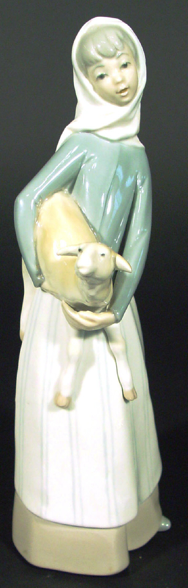 Appraisal: Lladro porcelain figurine clutching a lamb printed factory mark to