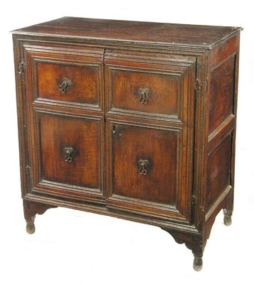 Appraisal: An early th century oak chest the boarded top above