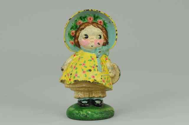 Appraisal: DOLLY DIMPLE DOORSTOP Full figure example of the adorable bright