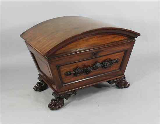 Appraisal: A Regency mahogany sarcophagus shaped cellaret with barrel top on