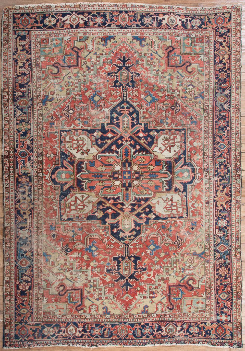 Appraisal: Antique Heriz Carpet red and blue ground central medallion and