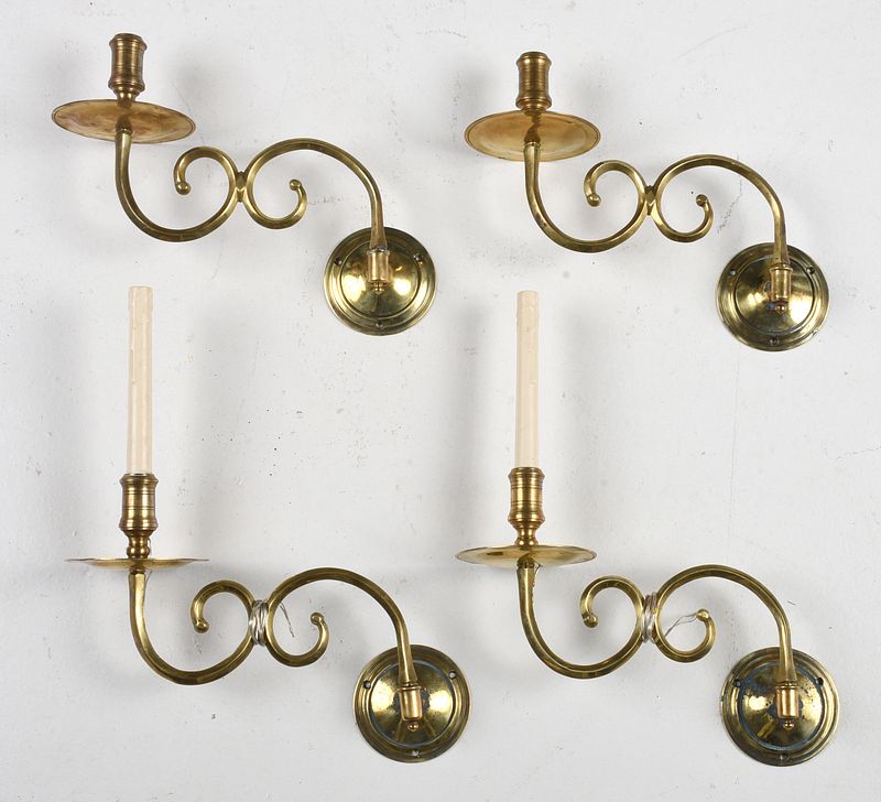 Appraisal: Group of Four Reproduction Brass Sconces with ribbed nozzles above