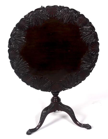 Appraisal: A Georgian style carved tripod table the scallop shell and