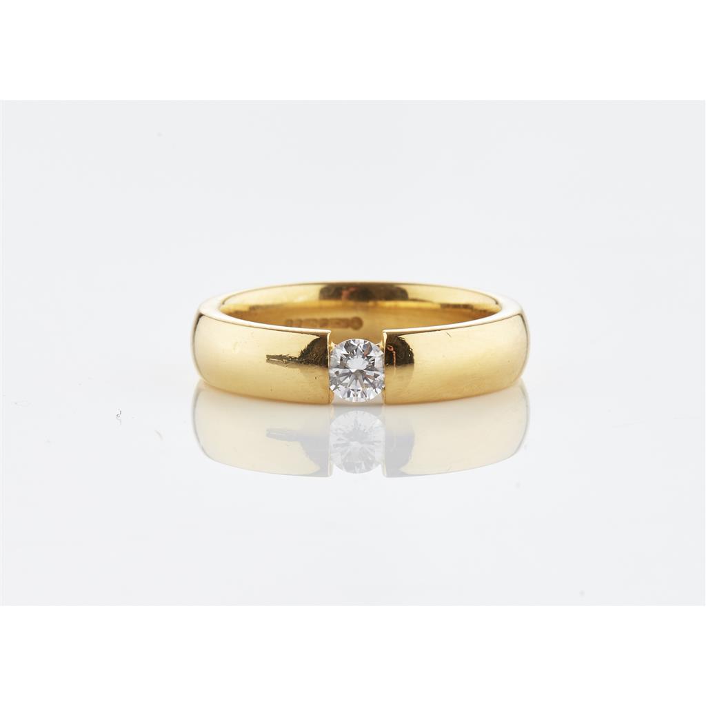 Appraisal: An ct gold diamond solitaire ring rubover set with a