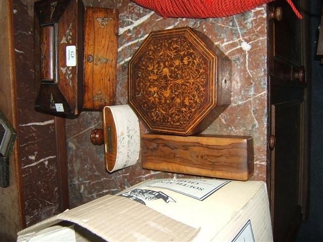 Appraisal: A rosewood and mother of pearl inlaid tea caddy wide