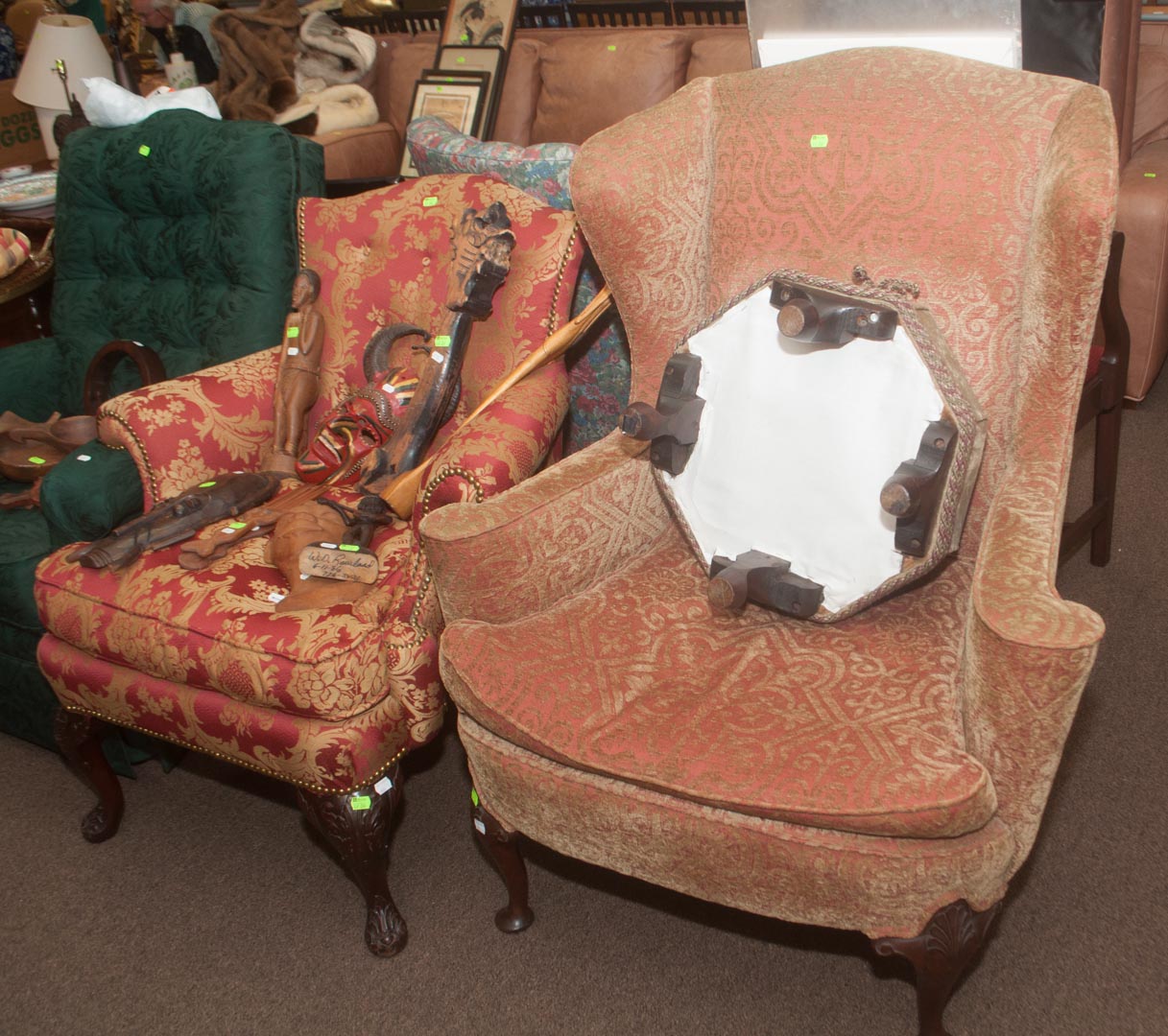 Appraisal: Two upholstered armchairs and a foot stool