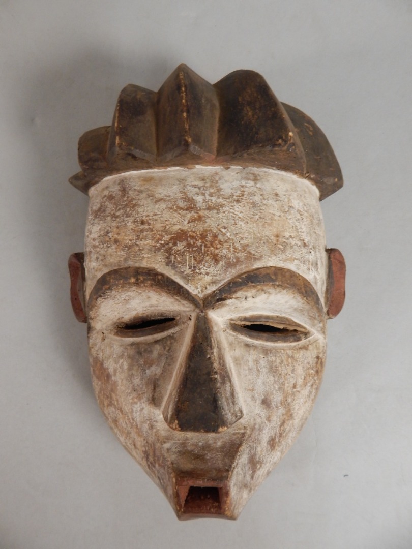 Appraisal: Tribal Art An African carved mask cm x cm