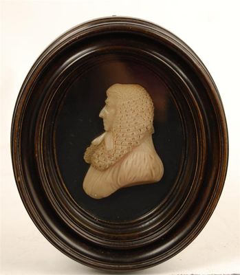 Appraisal: A wax portrait bust of a gentleman wearing a judicial