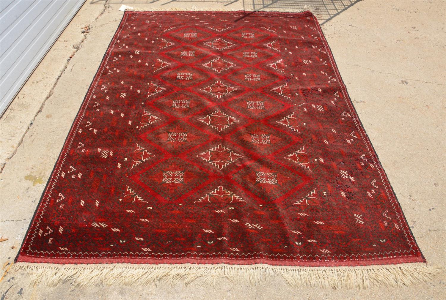 Appraisal: x red Turkish carpet