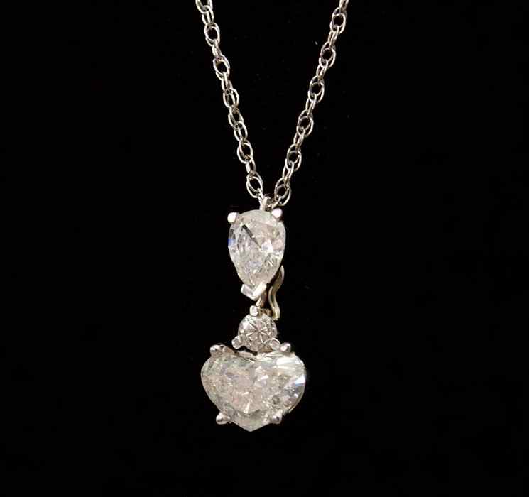 Appraisal: K THREE STONE DIAMOND PENDANT K yellow gold Ctw pendant