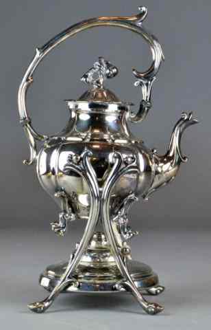 Appraisal: Silverplated Teapot with Warming Standwith blossom finial supported on scrollwork