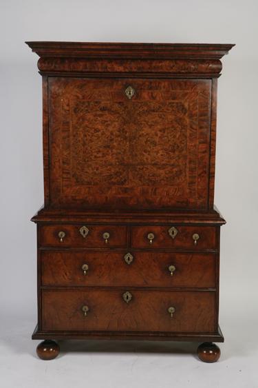 Appraisal: A WILLIAM AND MARY WALNUT VENEERED ESCRITOIRE with a moulded