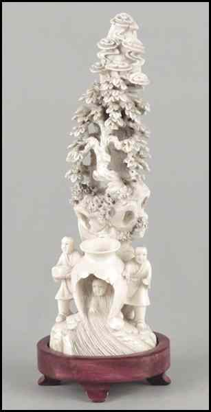 Appraisal: CARVED IVORY FIGURAL GROUP Depicting figures in a forest Raised