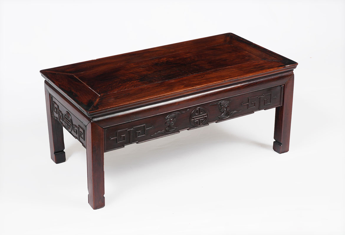 Appraisal: CHINESE CARVED ROSEWOOD LOW TABLE Rectangular tops carved skirt with