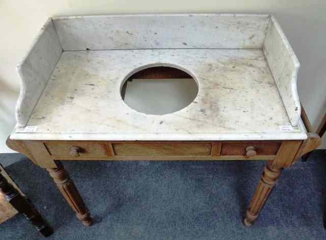 Appraisal: A stained pine washstand the marble top with three quarter