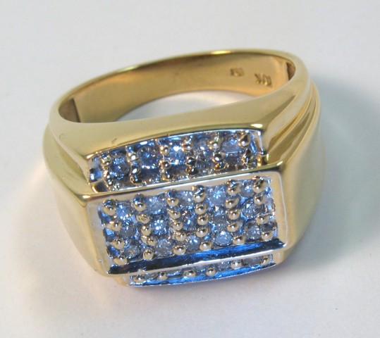 Appraisal: MAN'S DIAMOND AND TEN KARAT GOLD RING set with round-cut